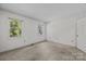 Bright, carpeted bedroom with two windows providing ample natural light at 2680 Heavens Ct, Fort Mill, SC 29715
