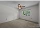 Bright bedroom with a ceiling fan and natural light streaming through the window at 2680 Heavens Ct, Fort Mill, SC 29715