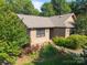 Charming single-story home with a combination of wood and brick, complemented by well-maintained landscaping and mature trees at 2680 Heavens Ct, Fort Mill, SC 29715