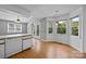 A spacious eat-in kitchen offers bright light from multiple windows and sliding glass doors which provide access to outdoor living at 2680 Heavens Ct, Fort Mill, SC 29715