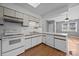 White cabinets and appliances offer a clean, classic design in this well-lit kitchen, ready for culinary adventures at 2680 Heavens Ct, Fort Mill, SC 29715