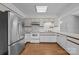 A kitchen featuring stainless steel appliances and white cabinets, creating a bright and efficient space for cooking and entertaining at 2680 Heavens Ct, Fort Mill, SC 29715
