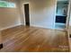 Cozy bedroom with hardwood floors and ample natural light from a high privacy window at 3049 Reid Ave, Charlotte, NC 28208