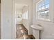 Bathroom featuring a pedestal sink with bright light from the window and views to another room at 404 Community St, Rock Hill, SC 29730