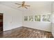 Bedroom showcasing wood-look flooring, large window, and neutral walls, creating a comfortable space at 404 Community St, Rock Hill, SC 29730
