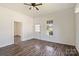 Cozy living room showcasing wood-look floors, white walls, and entry to additional rooms at 404 Community St, Rock Hill, SC 29730