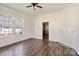 Bright living room featuring wood-look flooring, ample natural light, and a decorative fireplace at 404 Community St, Rock Hill, SC 29730