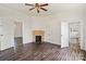 Spacious living room showcasing a fireplace and two entryways with bright, neutral walls at 404 Community St, Rock Hill, SC 29730