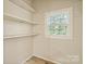 Small storage room with shelves and natural light at 404 Community St, Rock Hill, SC 29730