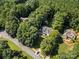 Beautiful aerial view of the home nestled among lush trees in a serene neighborhood at 480 Robinson Rd, Mooresville, NC 28117