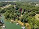 Aerial view of the home with lake access, surrounded by lush greenery at 480 Robinson Rd, Mooresville, NC 28117