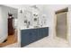 Bathroom with a blue vanity, double sinks, and white tile flooring at 480 Robinson Rd, Mooresville, NC 28117