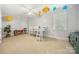 Bright bedroom features a ceiling fan, playful planet decorations, and a loft bed perfect for a room at 480 Robinson Rd, Mooresville, NC 28117