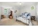 Bedroom with carpet, iron bed frame, and unique arched windows at 480 Robinson Rd, Mooresville, NC 28117