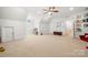 Spacious bonus room features bright natural light and a variety of spaces for children to play and explore at 480 Robinson Rd, Mooresville, NC 28117