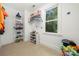 Well-organized walk-in closet featuring shelving and racks and a window for plenty of natural light at 480 Robinson Rd, Mooresville, NC 28117