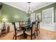 Formal dining room showcasing a hardwood floor, wainscoting, and six chairs at 480 Robinson Rd, Mooresville, NC 28117