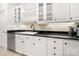 Kitchen area featuring black countertops, white cabinetry, and stainless steel appliances at 480 Robinson Rd, Mooresville, NC 28117