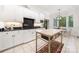 Modern kitchen featuring sleek appliances, an island, and elegant white cabinets at 480 Robinson Rd, Mooresville, NC 28117