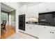 Modern kitchen featuring sleek appliances, double ovens, and elegant white cabinets at 480 Robinson Rd, Mooresville, NC 28117