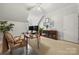 Bright home office features neutral walls, trim, a ceiling fan, and plenty of room to work from home at 480 Robinson Rd, Mooresville, NC 28117