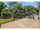 Large back deck surrounded by a lush treeline at 5126 Unaka Ave, Charlotte, NC 28205