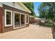Back deck and sunroom with sliding glass doors to enter the home at 5126 Unaka Ave, Charlotte, NC 28205