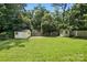Fenced backyard with two storage sheds at 5126 Unaka Ave, Charlotte, NC 28205