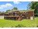 Backyard with stairs that lead up to the deck and basement access at 5126 Unaka Ave, Charlotte, NC 28205
