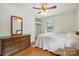 Bedroom boasts hardwood floors, ample closet space, and a vintage dresser at 5126 Unaka Ave, Charlotte, NC 28205