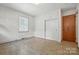 Bedroom with tiled flooring, closet, and large window at 5126 Unaka Ave, Charlotte, NC 28205