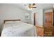 Bedroom featuring a floral bedspread, ceiling fan, and hardwood floors at 5126 Unaka Ave, Charlotte, NC 28205