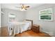 Bedroom with hardwood floors, white walls, and natural light at 5126 Unaka Ave, Charlotte, NC 28205