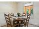 Eat-in dining area features a wood table with seating for four and a window with wooded views at 5126 Unaka Ave, Charlotte, NC 28205