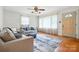 Bright living room with hardwood floors, neutral-toned sofas, and an abundance of natural light at 5126 Unaka Ave, Charlotte, NC 28205