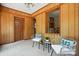 Relax in the sunroom featuring wood paneled walls and views into the house at 5126 Unaka Ave, Charlotte, NC 28205
