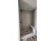 Walk-in shower features gray tile surround and a built-in bench at 638 Amberjack Pl # 76, York, SC 29745