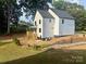 Backyard of a home with a dark shingle roof, white siding, and wooden deck at 908 30Th Avenue Nw Dr # 2, Hickory, NC 28601