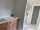 Bathroom with a double vanity with a white countertop and a framed mirror, next to shower at 908 30Th Avenue Nw Dr # 2, Hickory, NC 28601