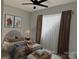 This bedroom is furnished with a queen-sized bed and has an upholstered accent bench at the foot of the bed at 908 30Th Avenue Nw Dr # 2, Hickory, NC 28601