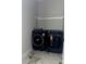 Laundry room with modern, front-load washer and dryer and a marble-look tile floor at 908 30Th Avenue Nw Dr # 2, Hickory, NC 28601