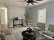 Bright living room featuring light grey walls, stairs, wood floors, and seating area near a window at 908 30Th Avenue Nw Dr # 2, Hickory, NC 28601