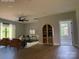 This open-concept living room offers a modern ceiling fan, wood floors, and a cozy seating arrangement at 908 30Th Avenue Nw Dr # 2, Hickory, NC 28601