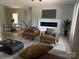 A modern living room boasts hardwood floors, a stylish fireplace, and two leather chairs at 908 30Th Avenue Nw Dr # 2, Hickory, NC 28601