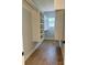 Walk-in closet with built-in shelving and a wooden floor with a window at 908 30Th Avenue Nw Dr # 2, Hickory, NC 28601