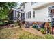 Home's backyard features a brick patio, screened-in porch, and outdoor seating at 10230 Blackstock Rd, Huntersville, NC 28078