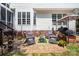 Outdoor patio area with chairs and well-maintained lawn at 10230 Blackstock Rd, Huntersville, NC 28078