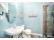 Well-lit bathroom with a stand-up shower, sleek vanity, and tiled floors at 10230 Blackstock Rd, Huntersville, NC 28078