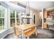 Sunny breakfast nook with a table and bench seating, surrounded by large windows offering an outdoor view at 10230 Blackstock Rd, Huntersville, NC 28078