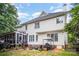Exterior rear view of home with a well-kept lawn and patio at 10230 Blackstock Rd, Huntersville, NC 28078